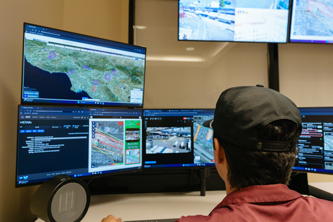 Multiple monitors display the information pilots need to remotely operate drones. 